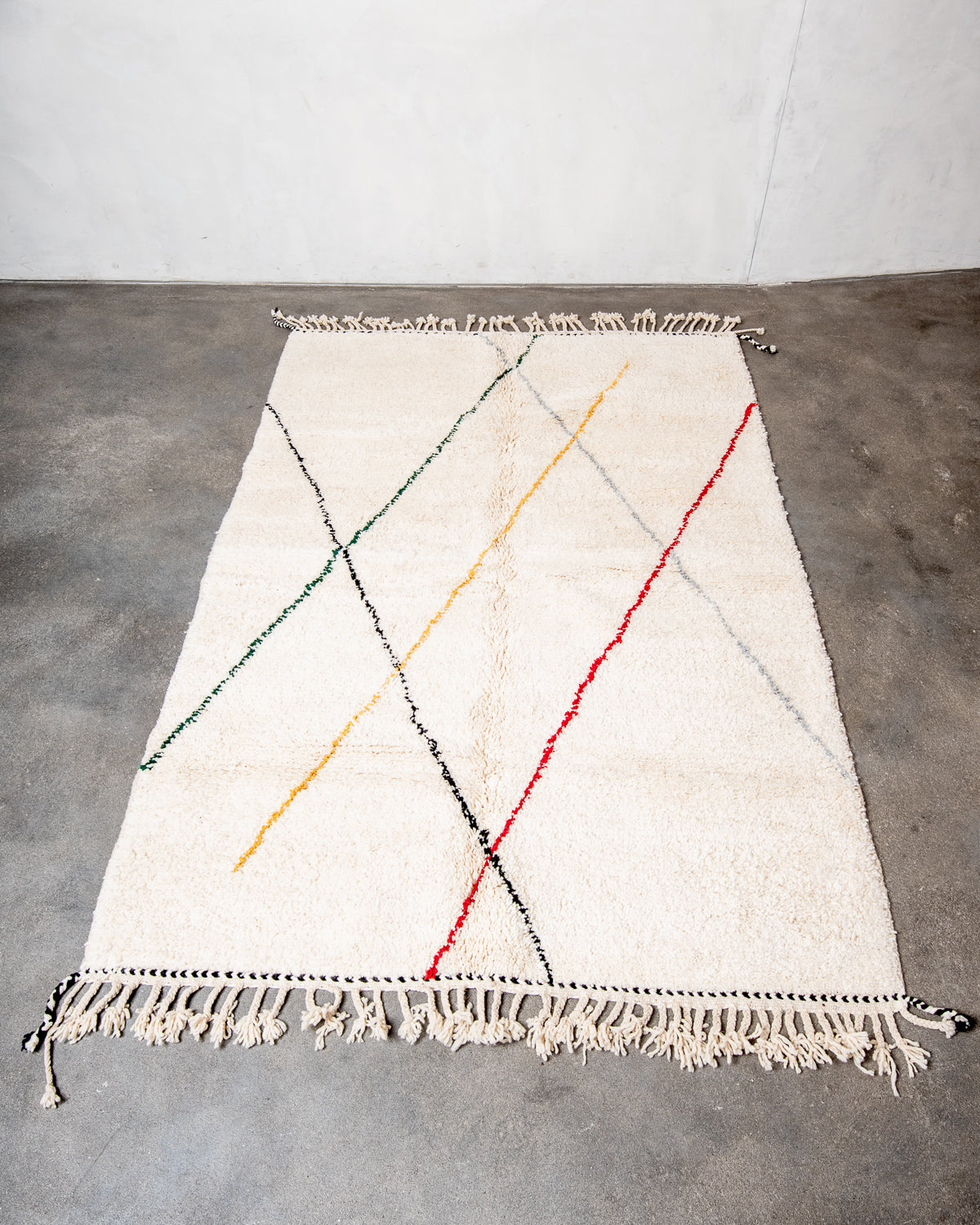 Modern, designer, handcrafted Berber rug from Morocco. Beniourain carpet with beautiful colours and patterns and fluffy wool texture.